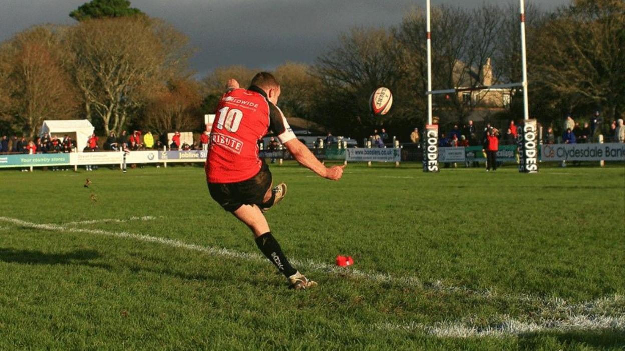 Rob Cook kicks a penalty for Cornish Pirates at Camborne's Recreation ground in November 2009