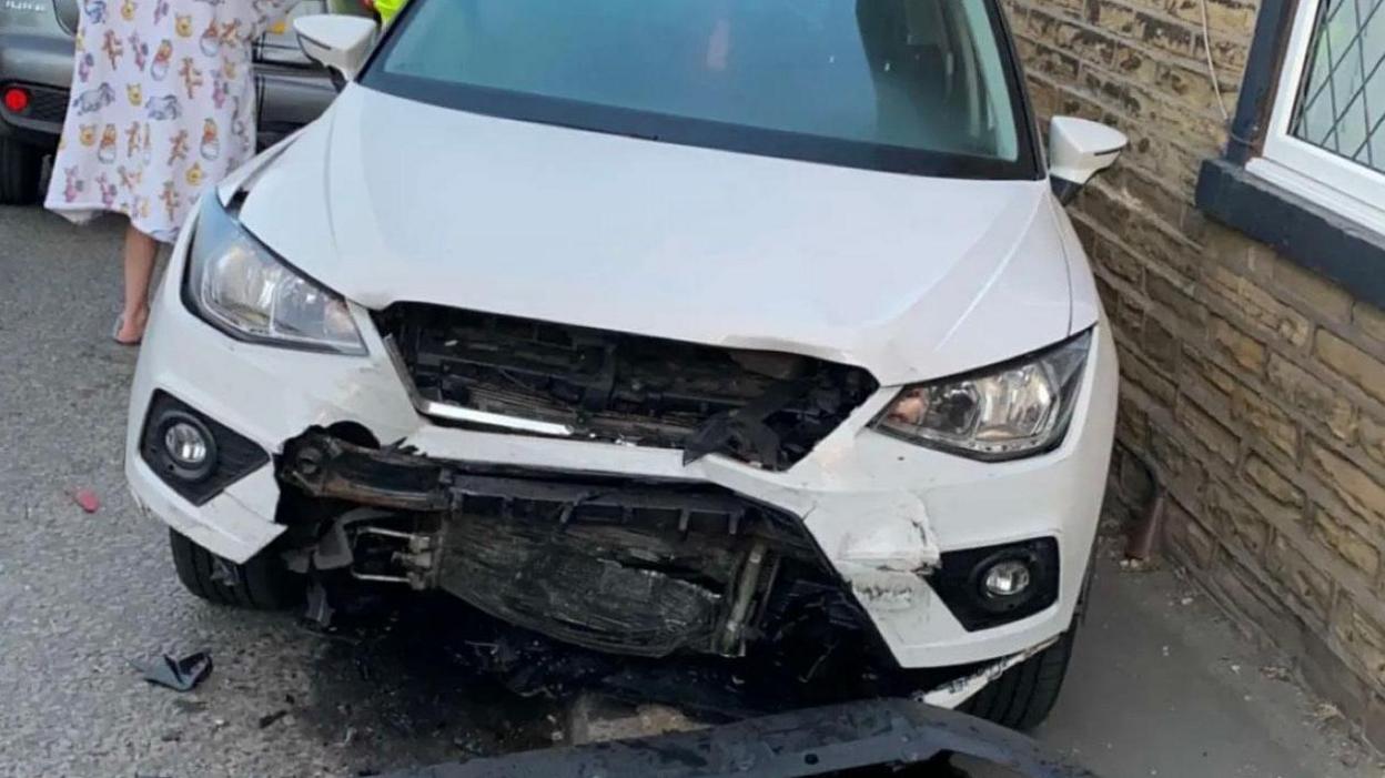 A damaged car following the Queensbury incident