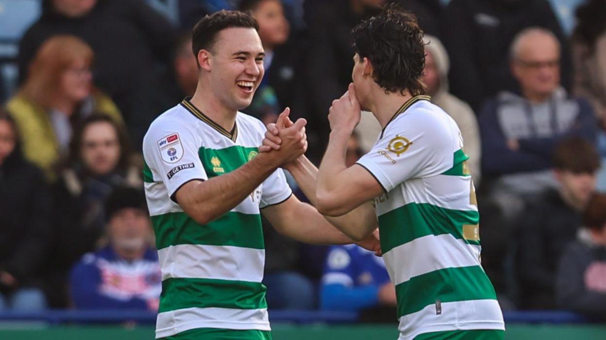 Queens Park Rangers player Harvey Vale celebrates his goal against Leicester City with team-mate Ronnie Edwards.
