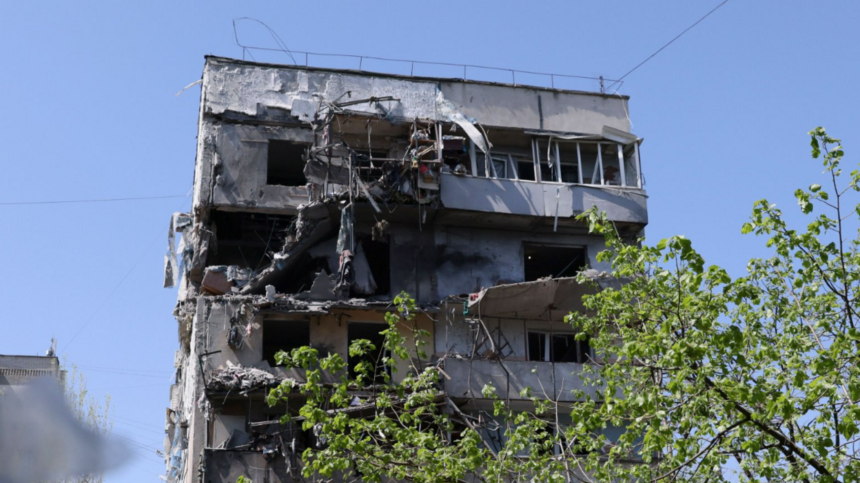 The damaged high-rise residential building with a collapsed facade and balconies after a Russian missile strike in Zaporizhzhia, southeastern Ukraine on 22 April 2025