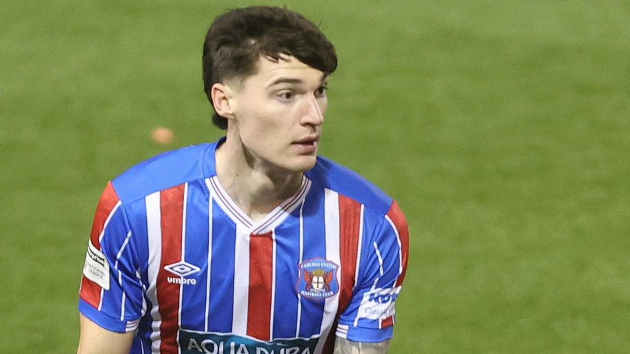 Carlisle midfielder Harvey Macadam looks up in last season's FA Cup tie against Blackpool