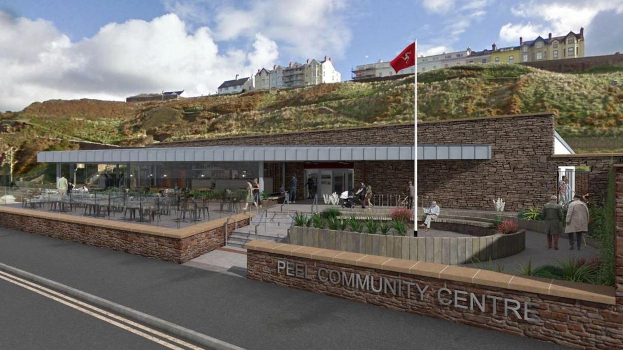 A mock-up of what the hub would look like. It is a one-storey building with a flat roof made out of brown brick. The cafe terrace is surrounded by glass and has chairs and tables. A sign reads Peel Community Centre. A white flagpole has a Manx flag flying at the top.