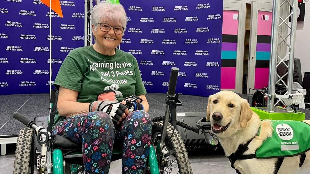 Mary Lamb with her assistance dog Sheldon