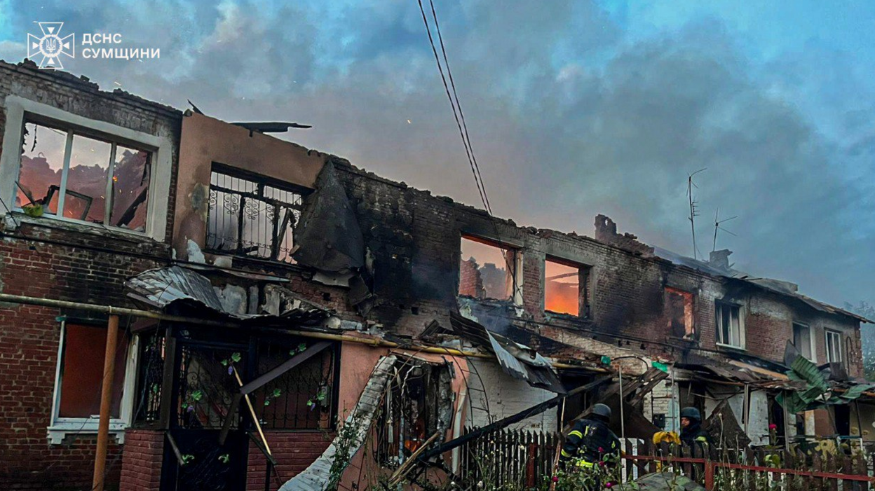 Ukrainian firefighters tackle a blaze at a house destroyed in a Russian drone attack in the village of Chernechchyna. Photo: 30 September 2025