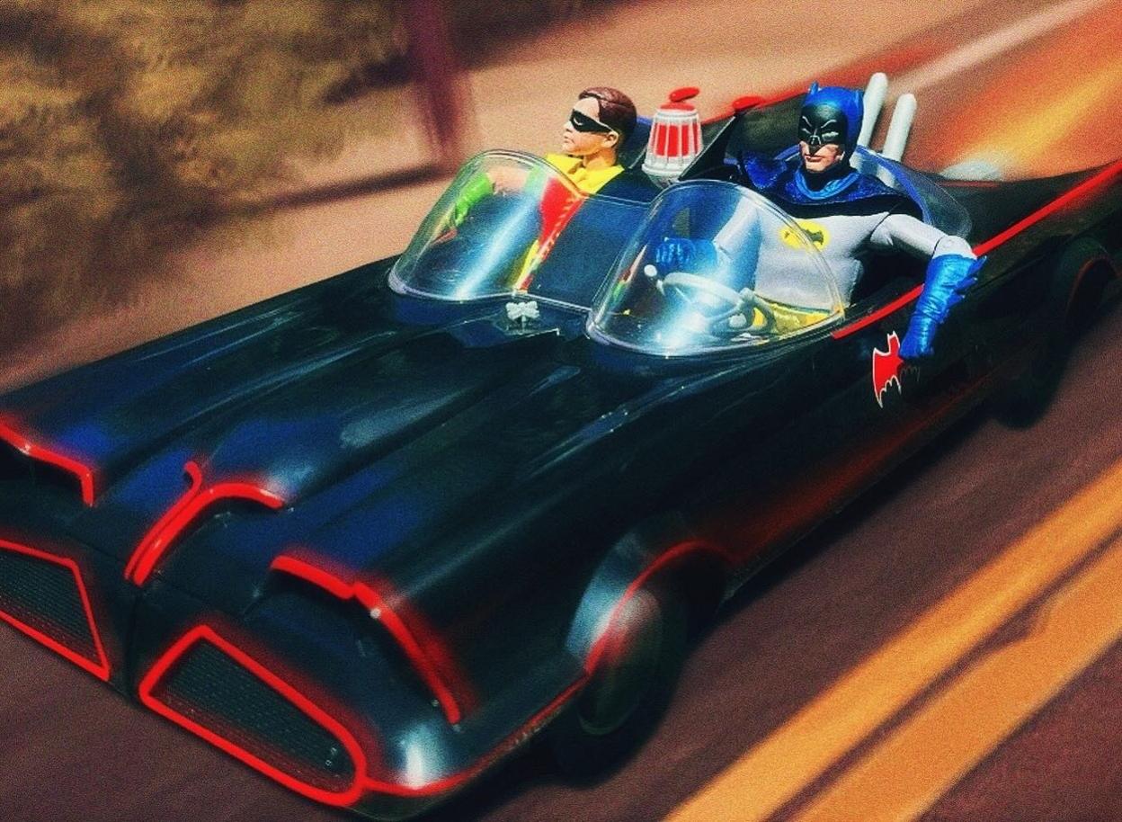 A model of Batman and Robin in the Batmobile 