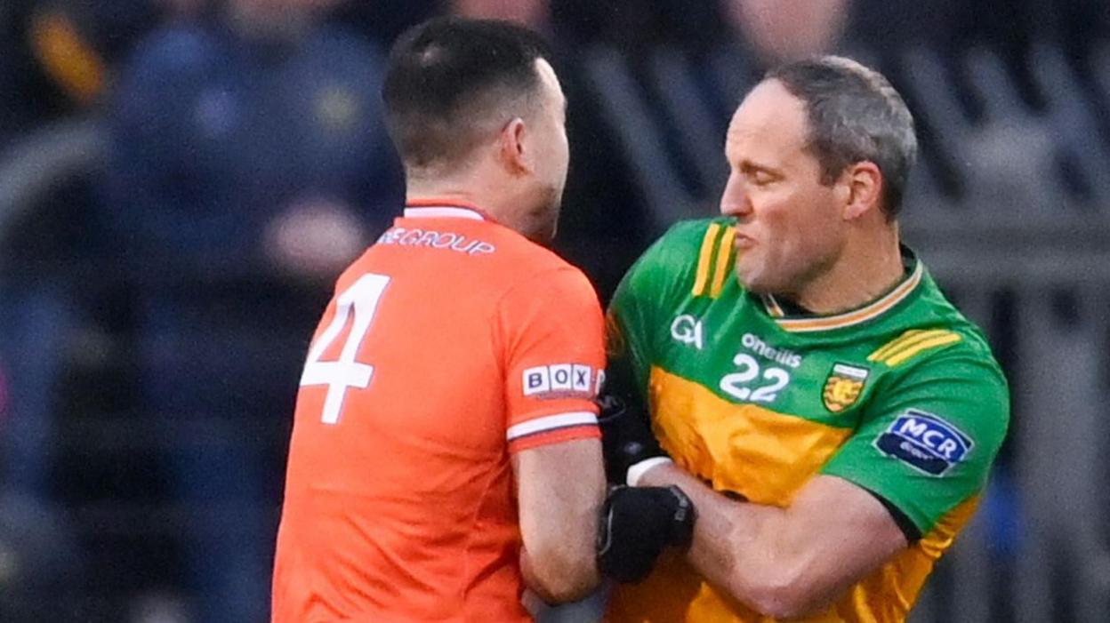 Aidan Forker with Michael Murphy after the Donegal player's introduction early in the second half at Ballybofey