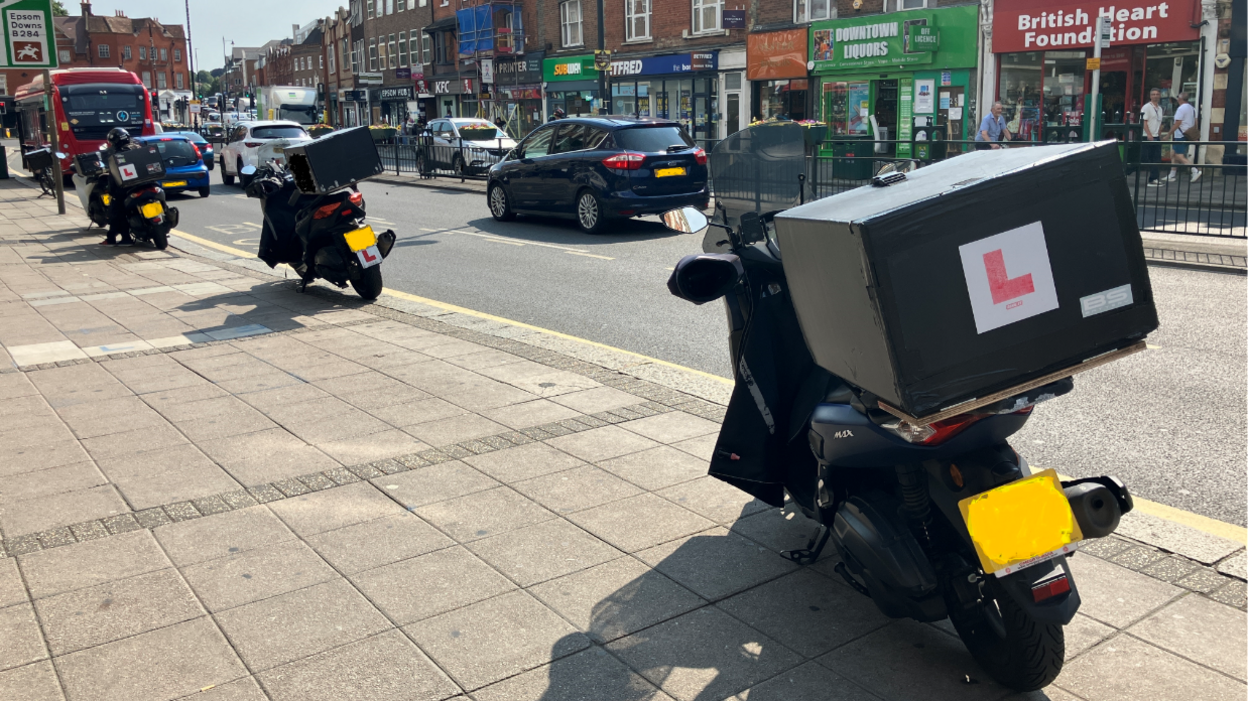 Epsom High Street, motorcycles on the pavement, Subway, KFC