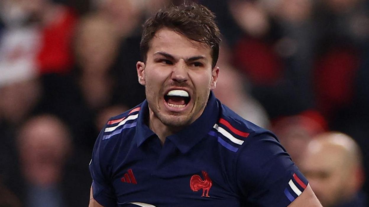 France captain Antoine Dupont celebrates