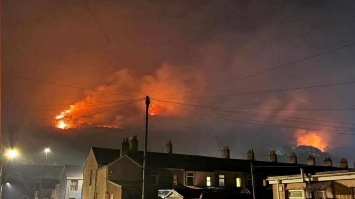 Wildfire at night above Cwmavon