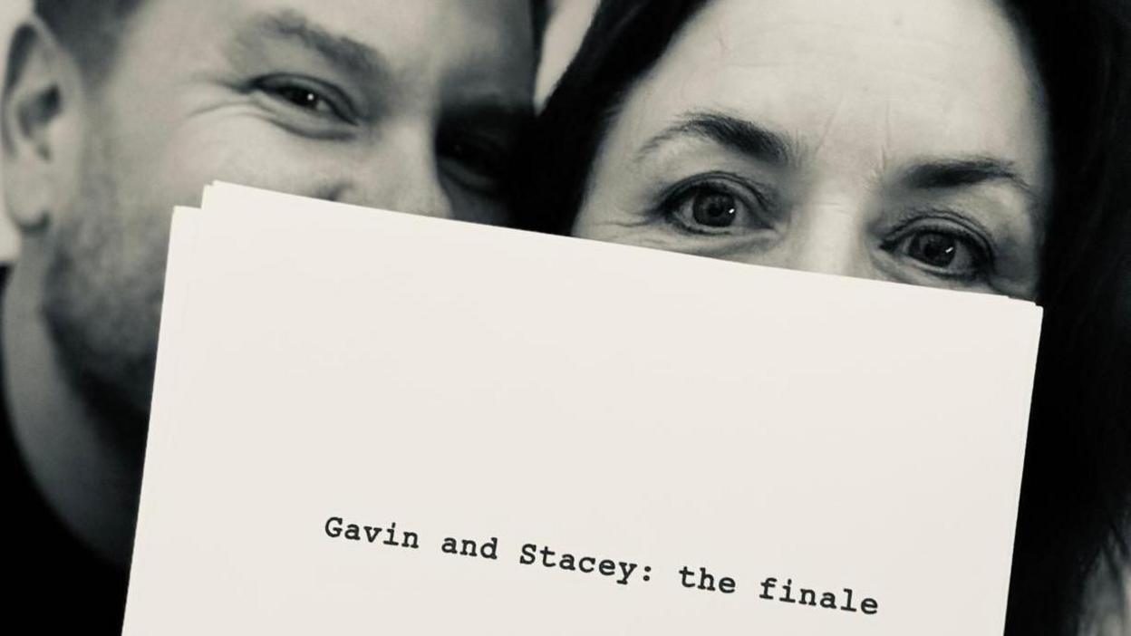 James Corden and Ruth Jones with a script hiding their faces