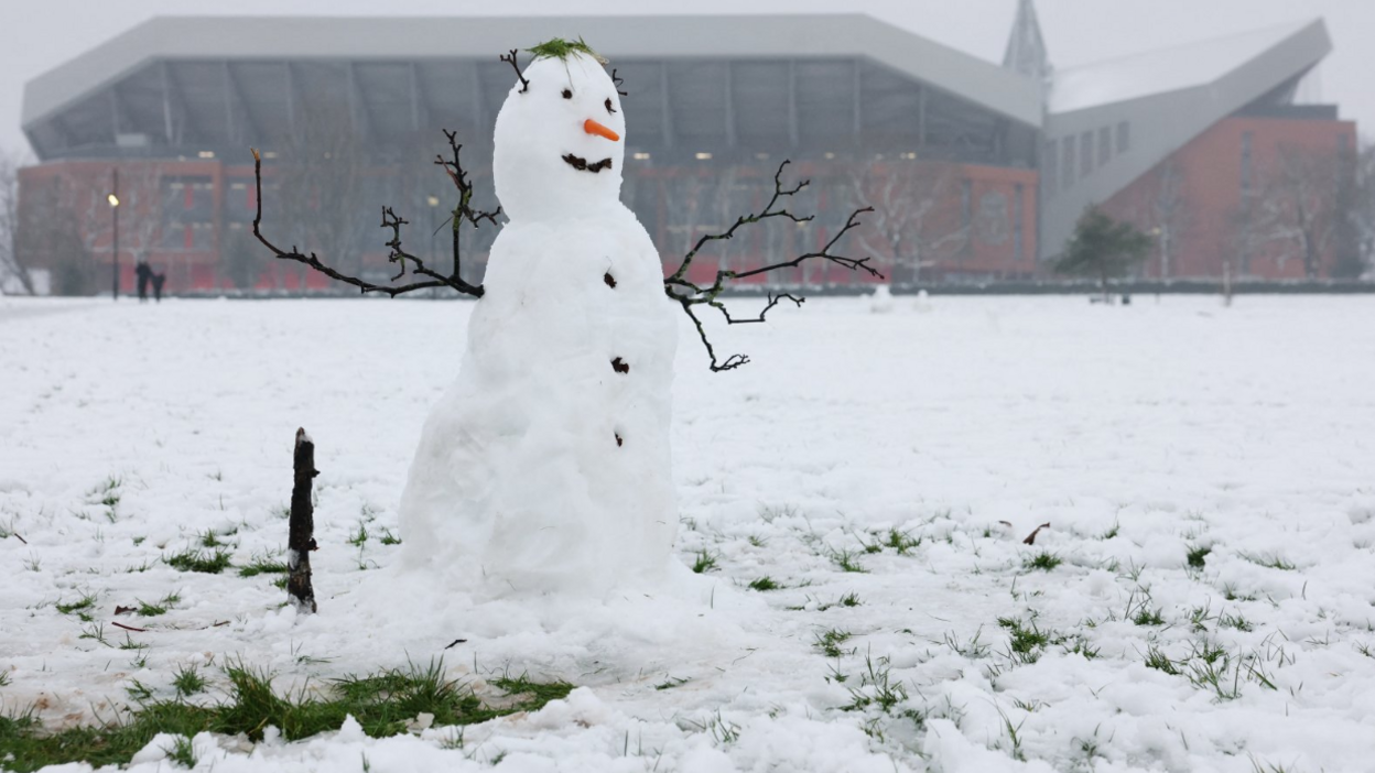 A snowman is seen outside Anfield stadium in Liverpool ahead of the Premier League clash against Manchester United.