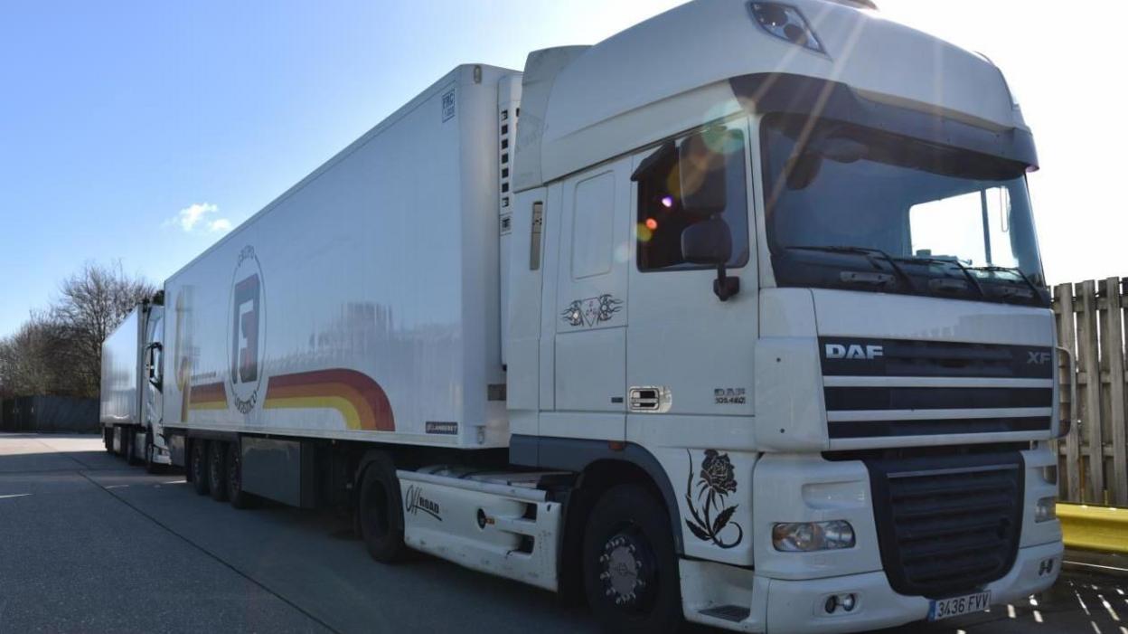 Photo of the white lorry driven by a member of the people smuggling gang smashed by the National Crime Agency.