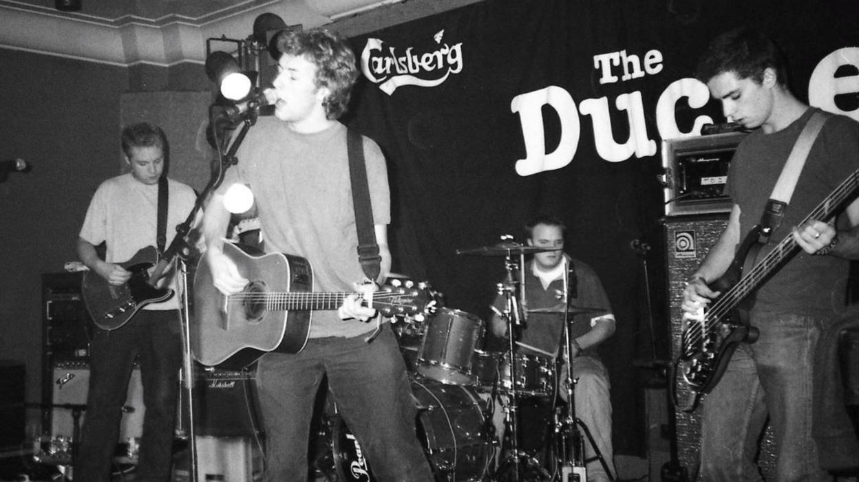 Coldplay playing The Duchess in the 90s - a black and white photo