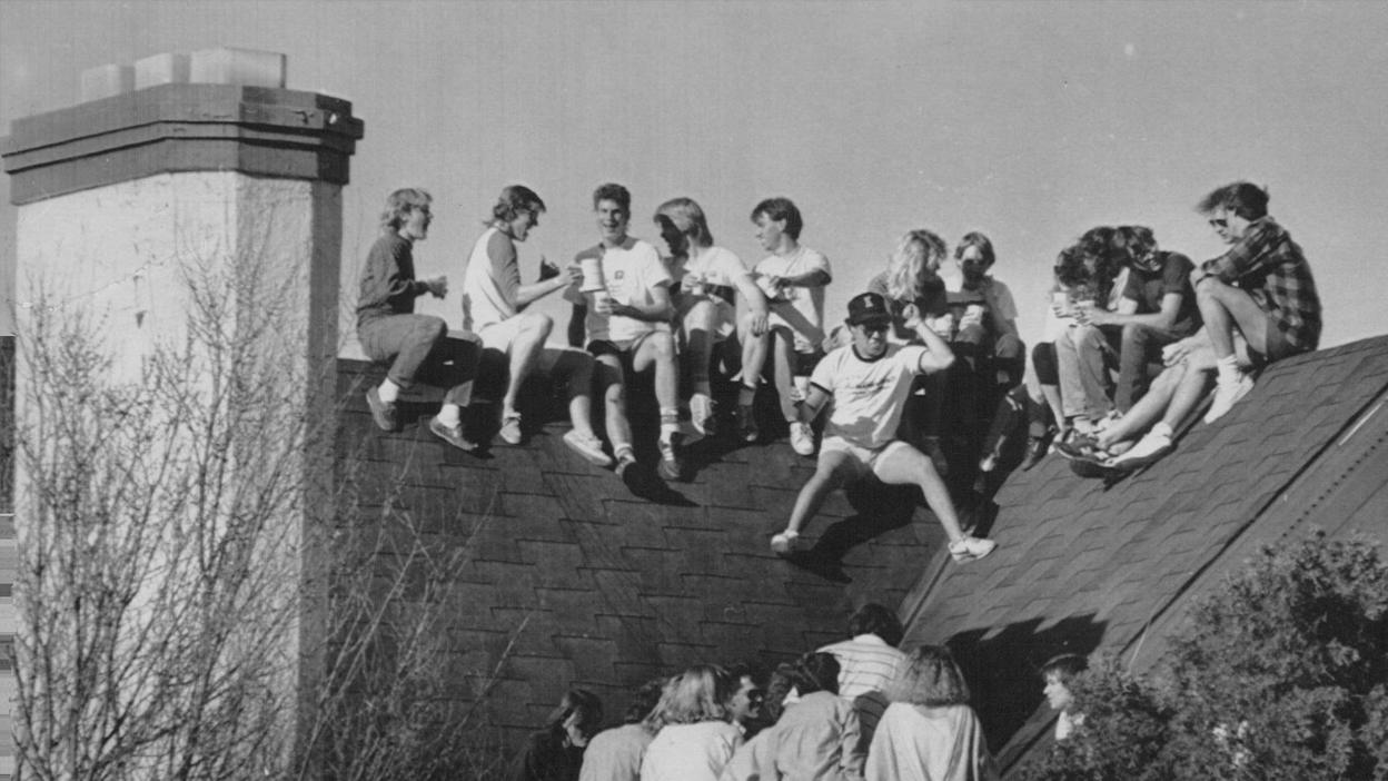 Members of Sigma Ki party up on the roof of their Frat house.