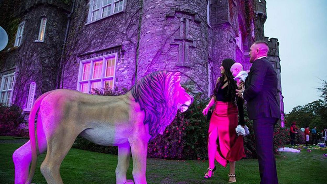 Conor McGregor with girlfriend Dee Devlin and son Conor Jr with fake lion