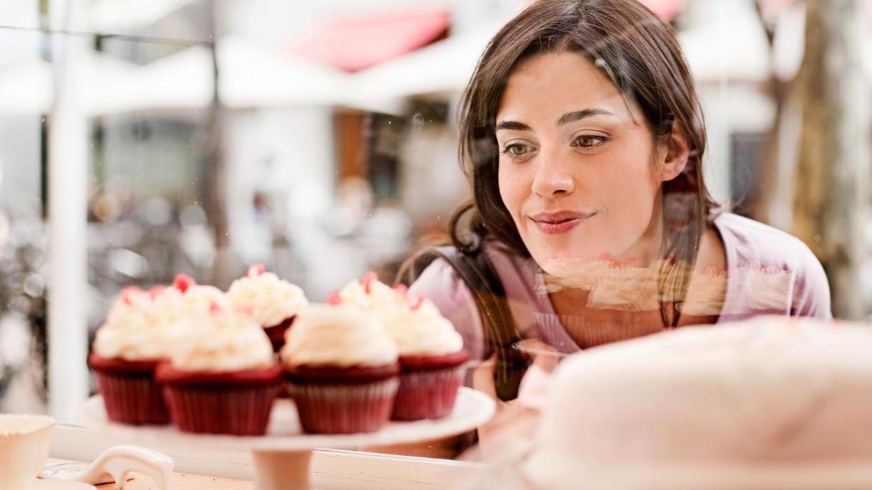 Woman looking at cakes
