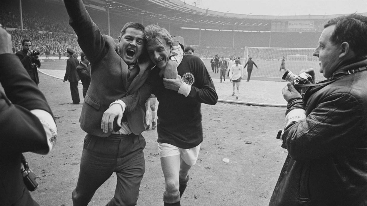 Scottish fan celebrates with Denis Law in 1967