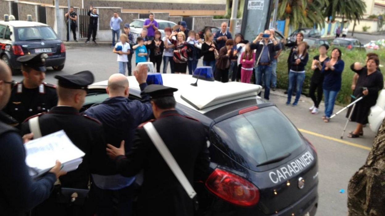 Giuseppe Pesce getting into a police car