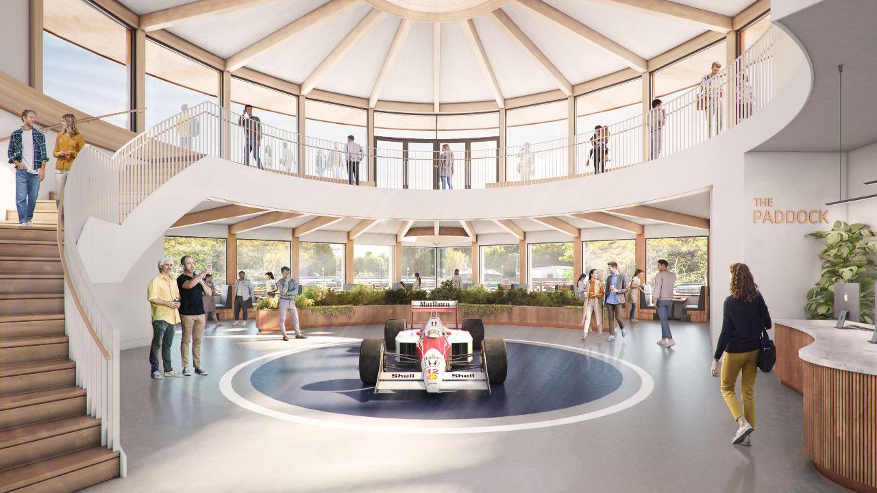 An artist's impression of the proposed new interior of Buckmore Park, showing a F1 car in the centre of reception, with people walking around it on a circular balcony