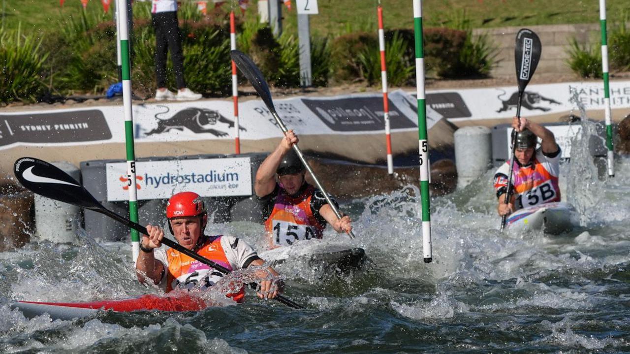 Joe Clarke, Ben Haylett and Jonny Dickson in action in the men's team kayak event.