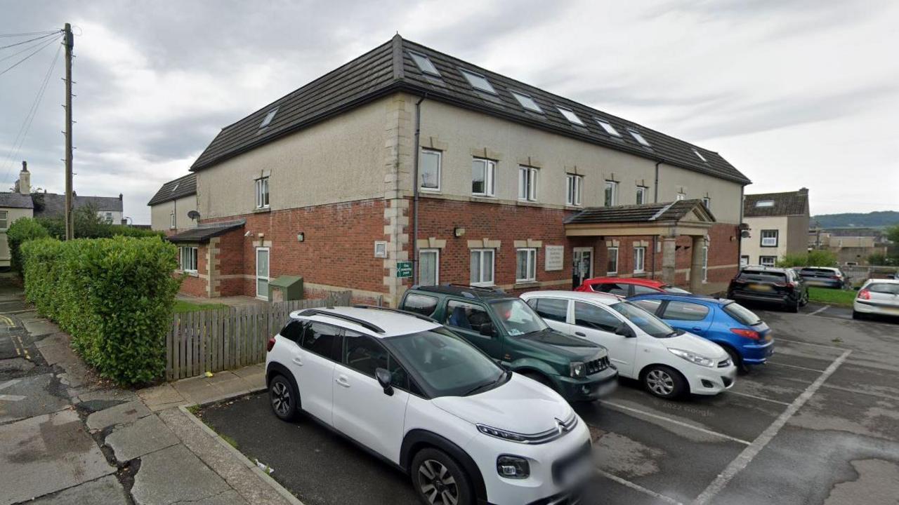 A Google Street View screenshot of the outside of Wyndham Manor care home.