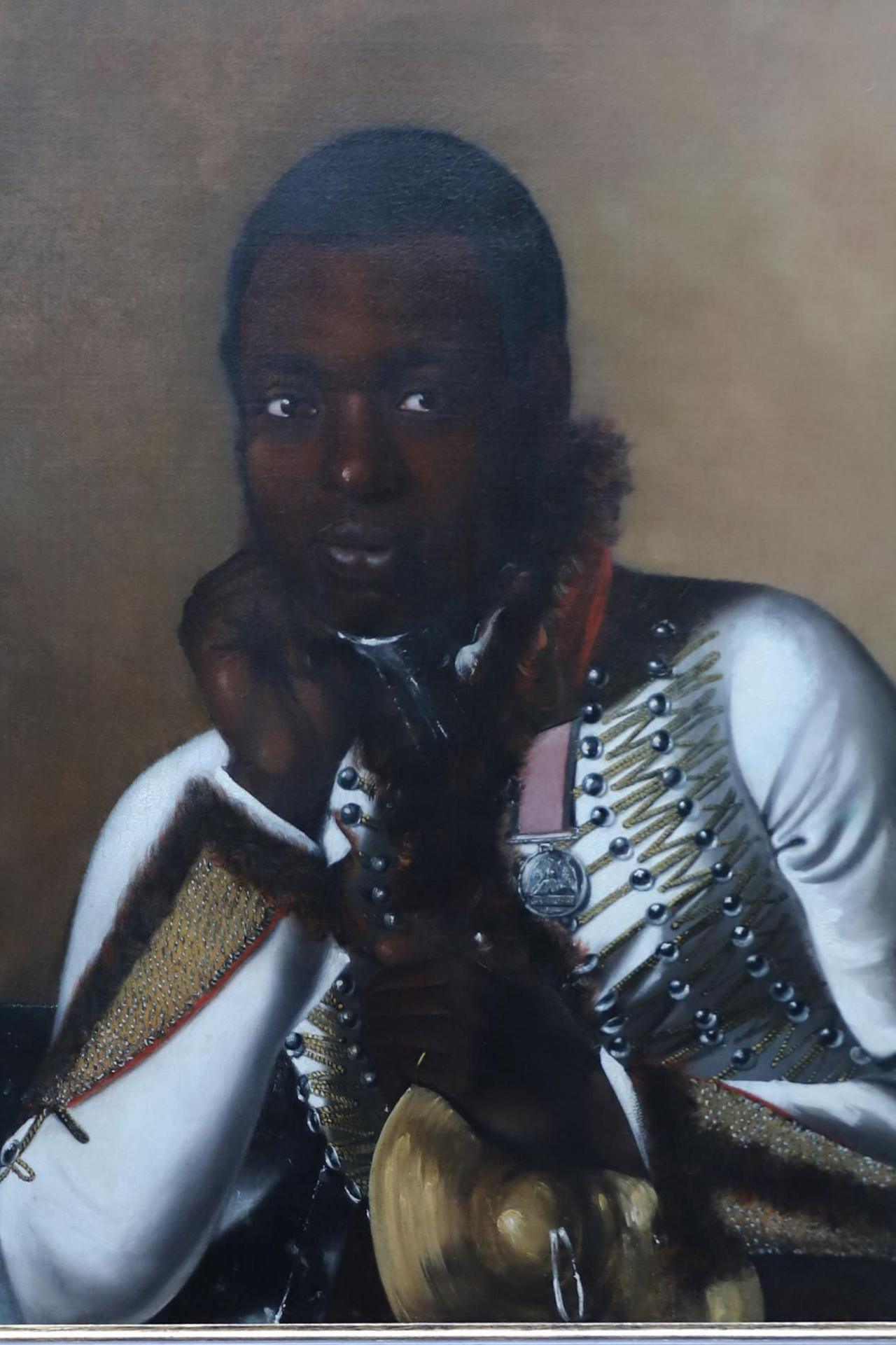 A portrait of a black man in 19th Century military dress, holding a cymbal
