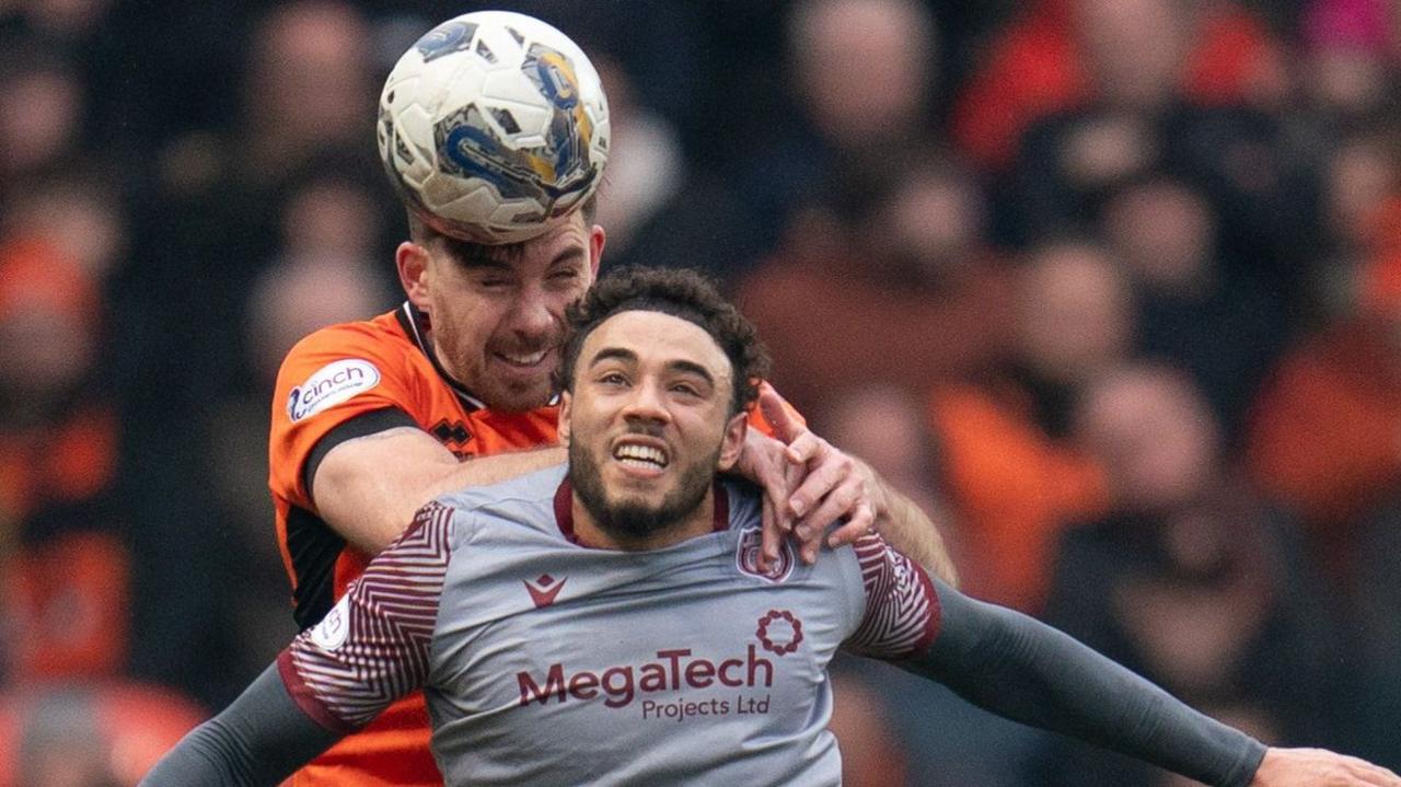 Jay Bird (right) in action for Arbroath against Dundee United