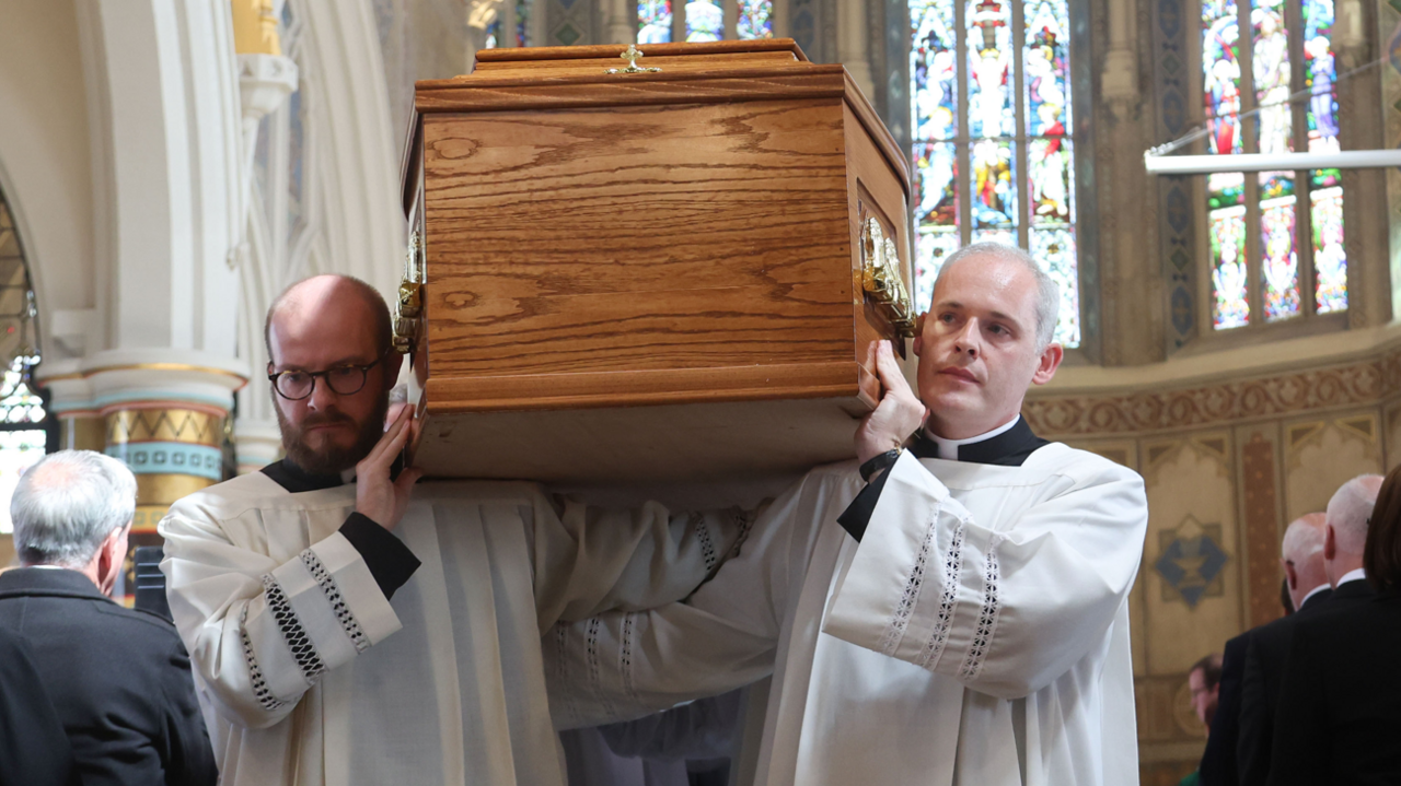 Coffin is carried at St Peter's Cathedral in Belfast on 20 August, 2024