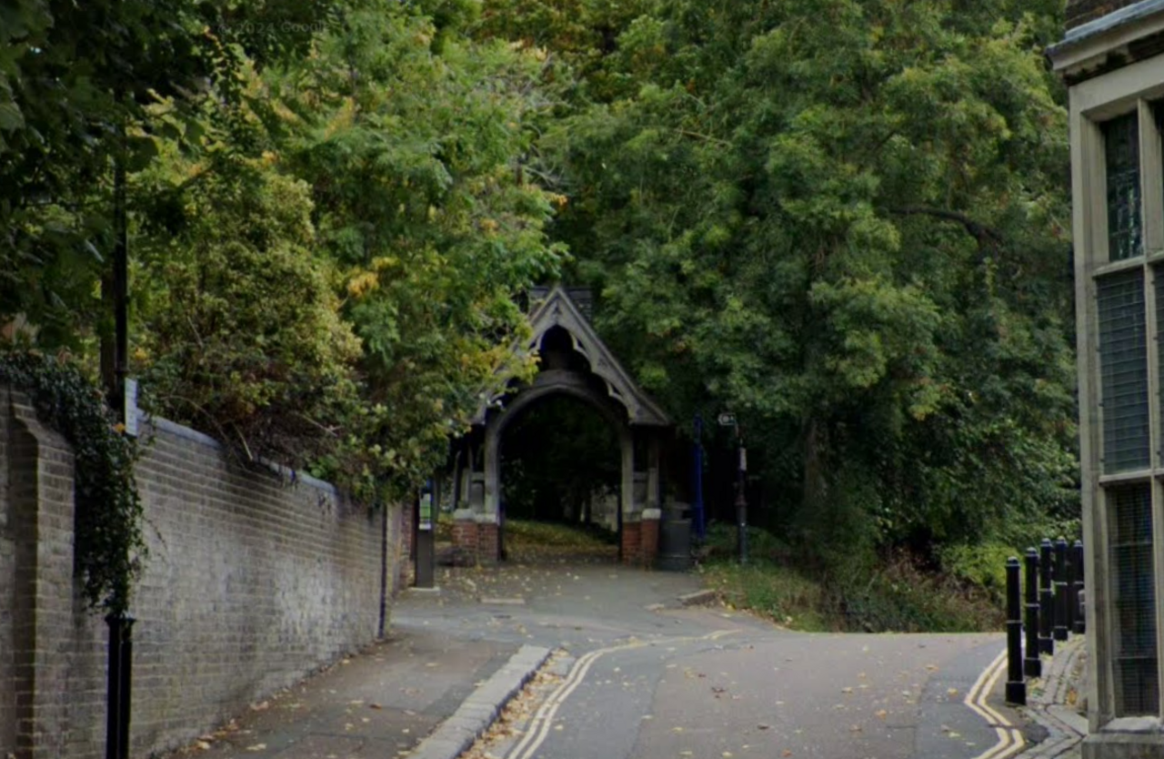 A narrow road and entrance to a church 