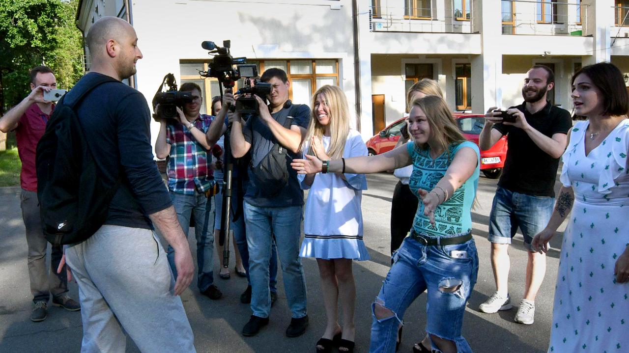 Arkady Babchenko is reunited with work colleagues