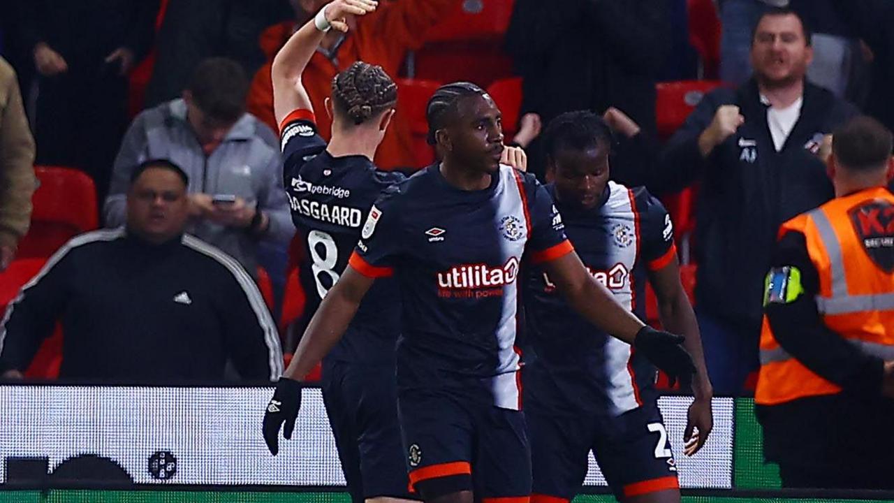 Luton Town celebrate their equaliser against Stoke City in the Championship