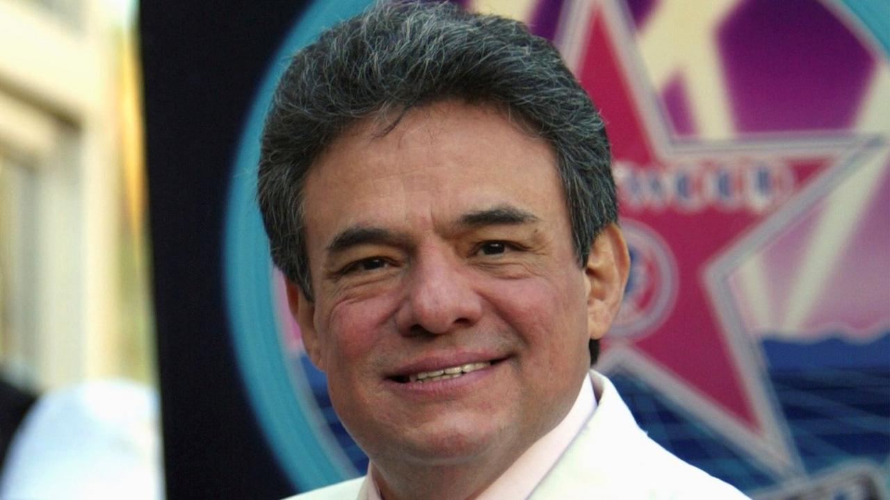 José José holds his plaque after receiving a star on the Hollywood Walk of Fame in February 2004.