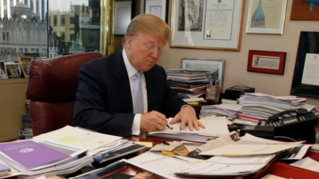 Trump sits at his desk in Trump Tower in 2010