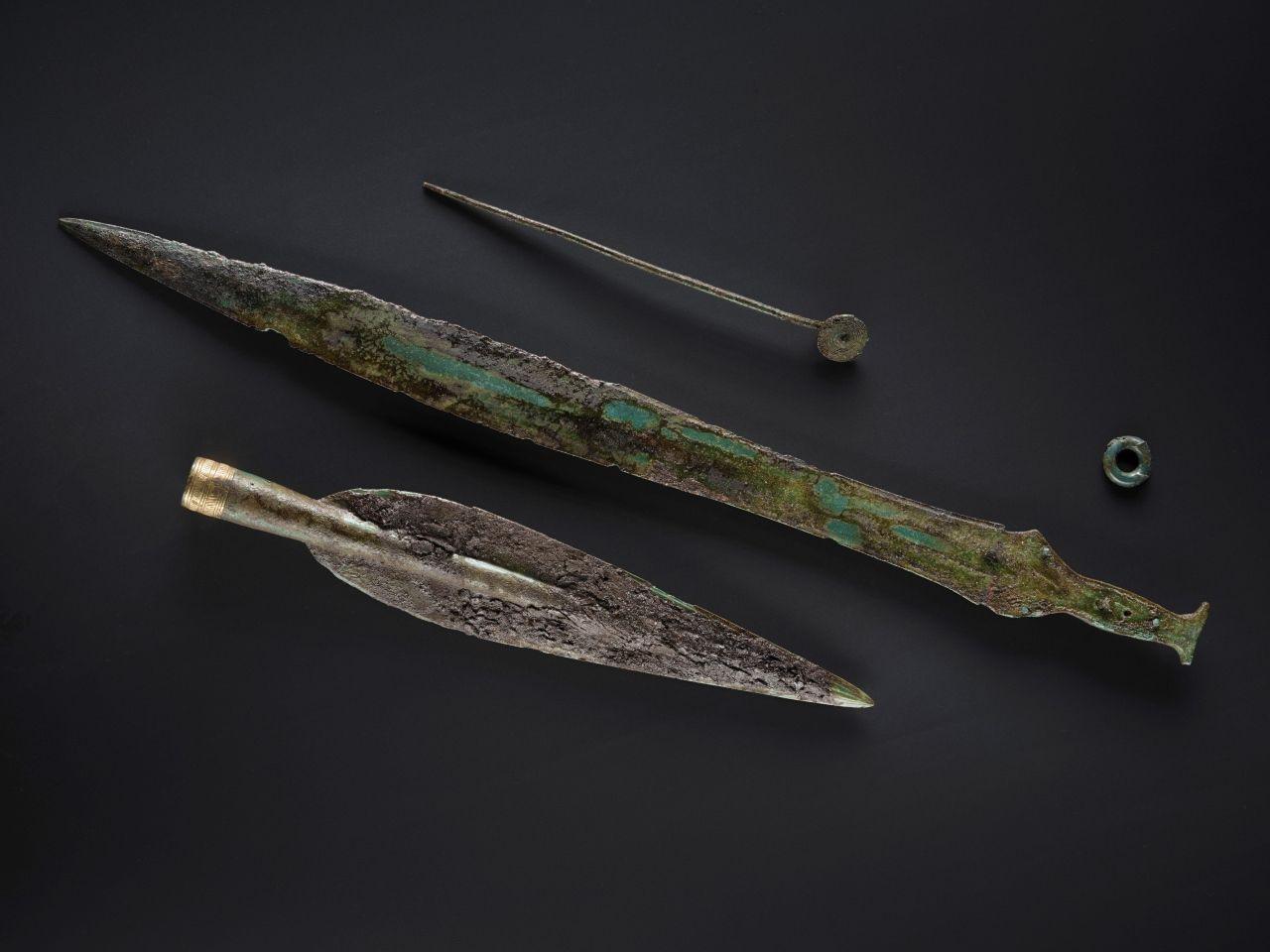 A spearhead and sword from a collection of Bronze Age items