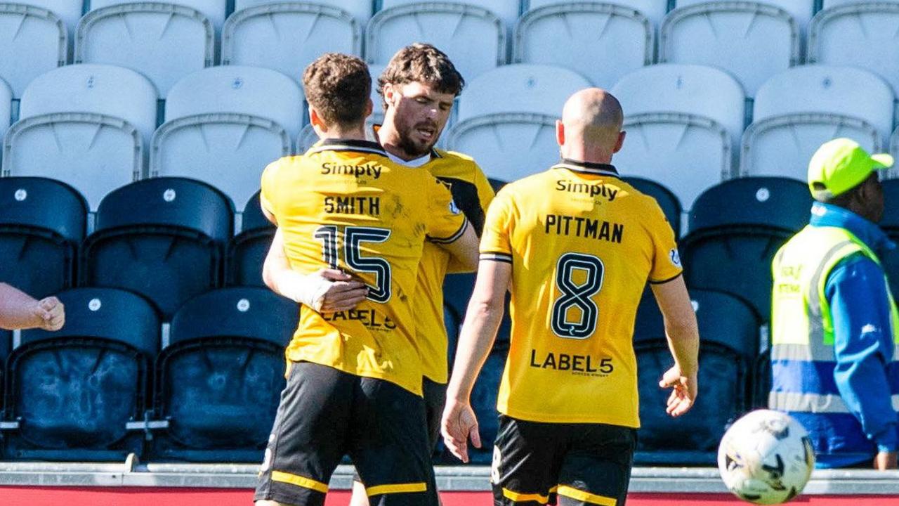 Robbie Muirhead celebrates with his team-mates