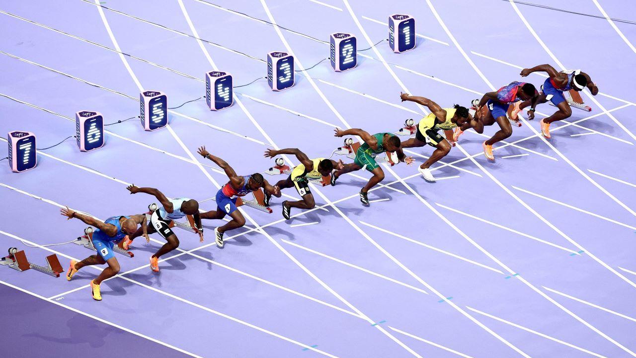 Runners at the start of the men's 100m final 