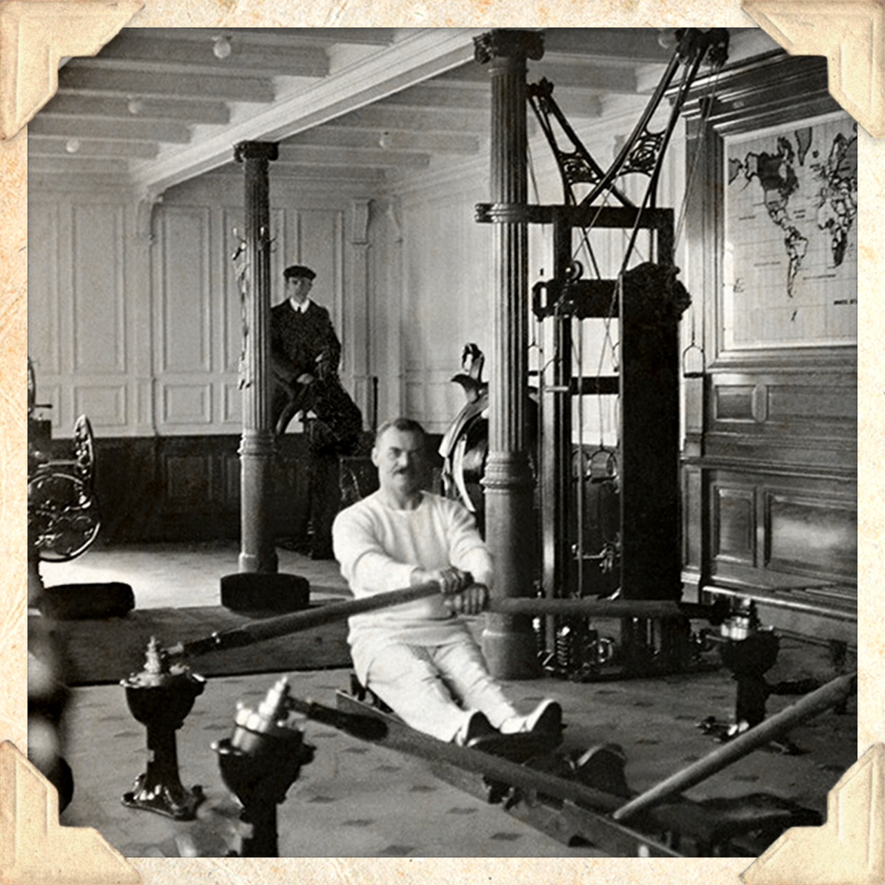 A black and white photo of a man using an exercise machine at a gym on the Titanic (photo Getty Images)