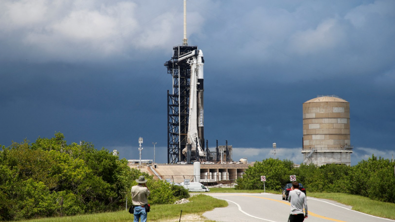 A SpaceX Falcon 9 rocket is prepared for launch of Polaris Dawn, a private human spaceflight mission, as photographers look on at the Kennedy Space Center in Cape Canaveral, Florida on August 26, 2024.