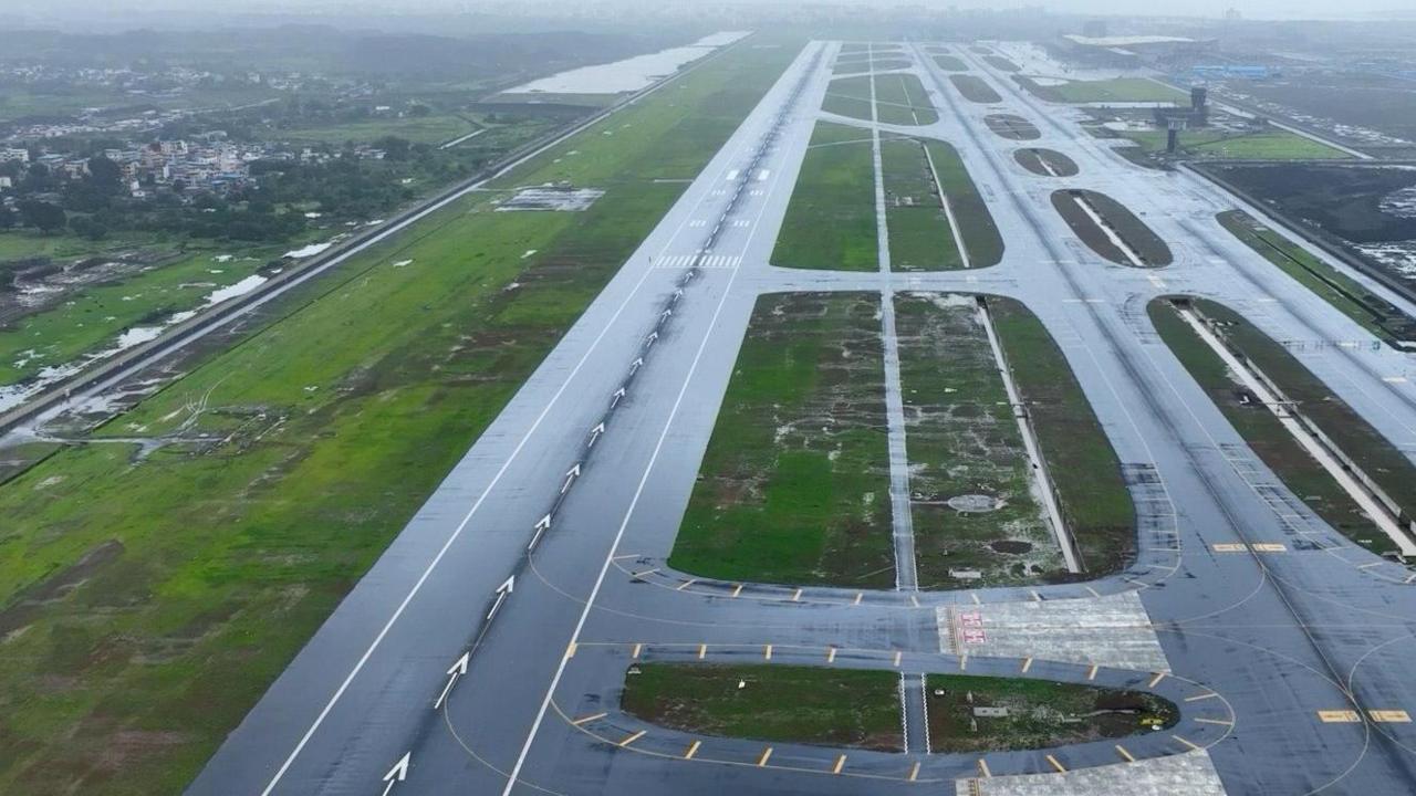 The image shows the newly constructed runways at NMIA on an overcast, slightly cloudy day. 