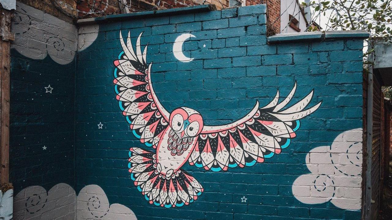 mural of owl at night