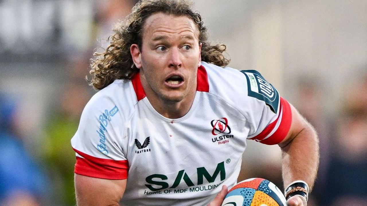Werner Kok in action for Ulster wearing a white jersey