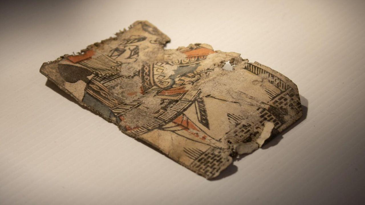 The Jack of Spades was discovered under the floorboards of the Commissioner's House during its restoration. Three of its corners were cut off in uneven angles.