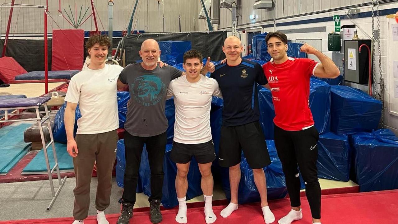 Gymnasts and staff celebrating