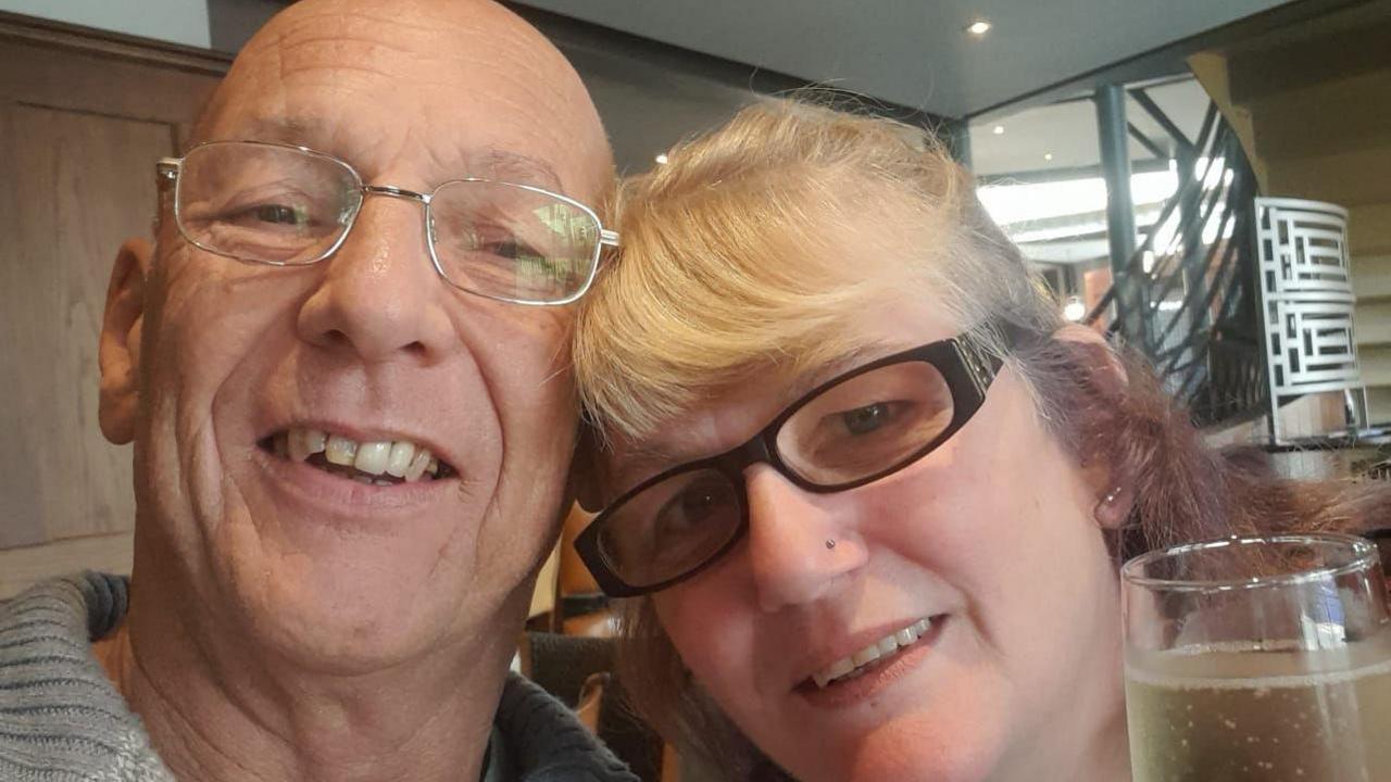 Steven and Julie Murfin pose for a selfie. They are both wearing glasses and their heads are touching as they lean in together