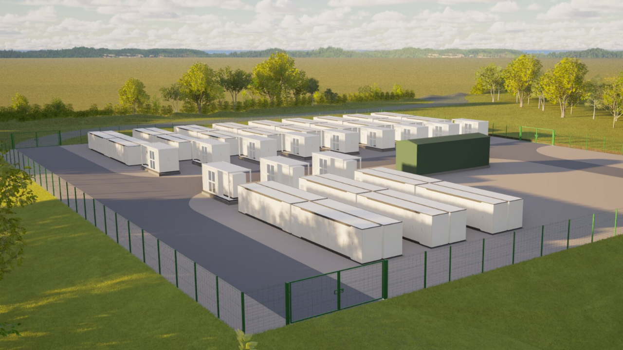 A digitally-generated design of the battery storage site, comprising white rectangular block buildings in parallel on grey hardstanding, surrounded by green fencing and fields 