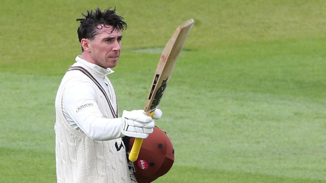 Surrey's Dan Lawrence celebrates scoring his century against Hampshire at The Kia Oval