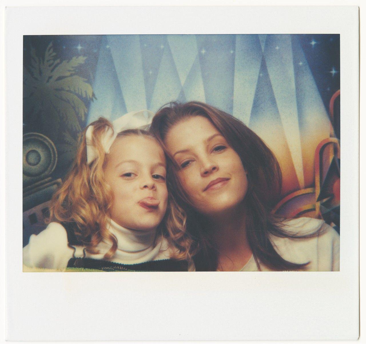 Lisa and Riley in a photo booth