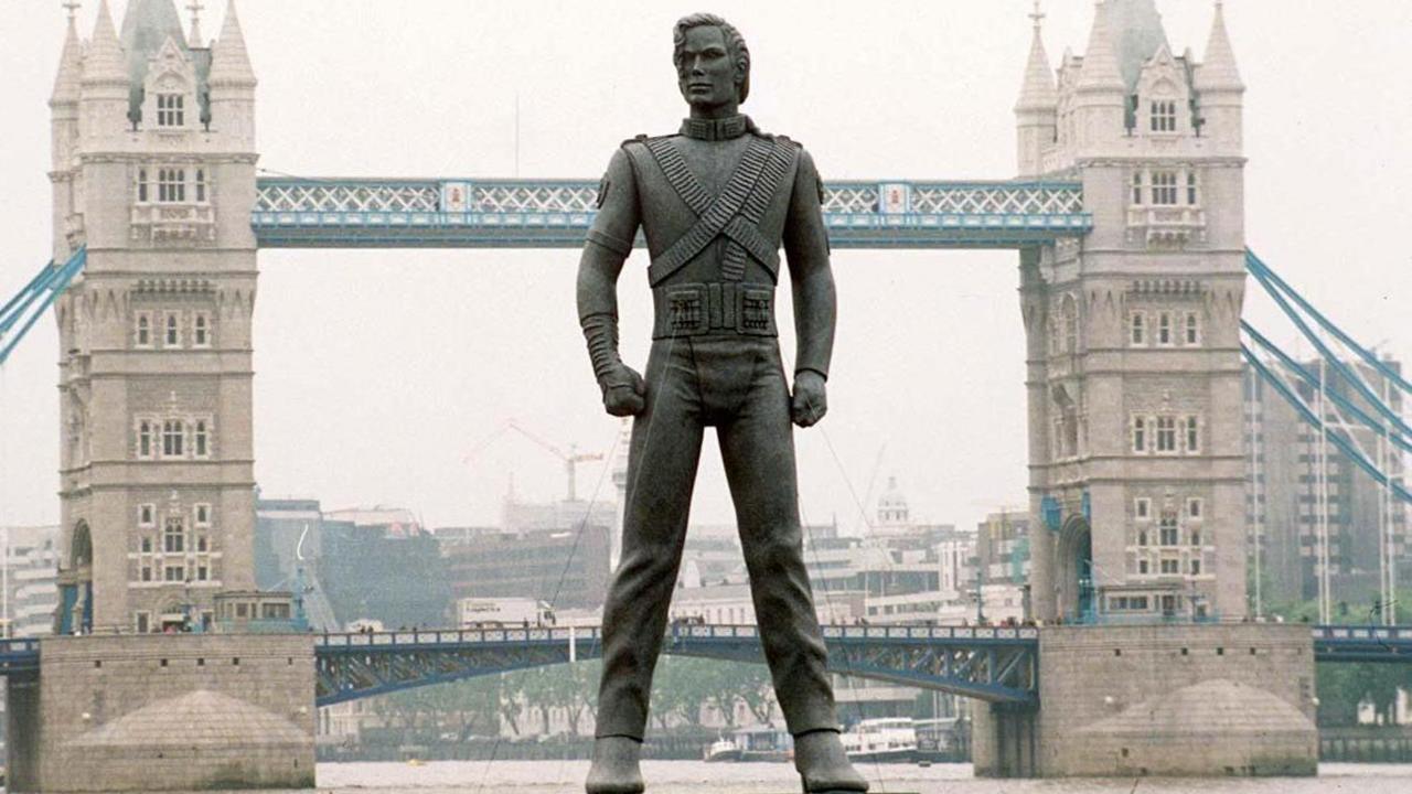 A giant Michael Jackson statue appears to be stood on the River Thames in front of Tower Bridge.