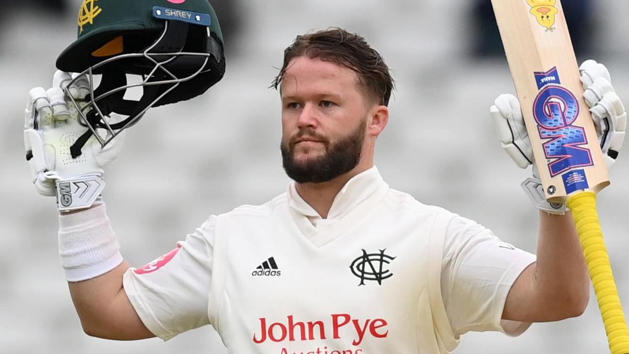 Ben Duckett celebrates a century for Nottinghamshire