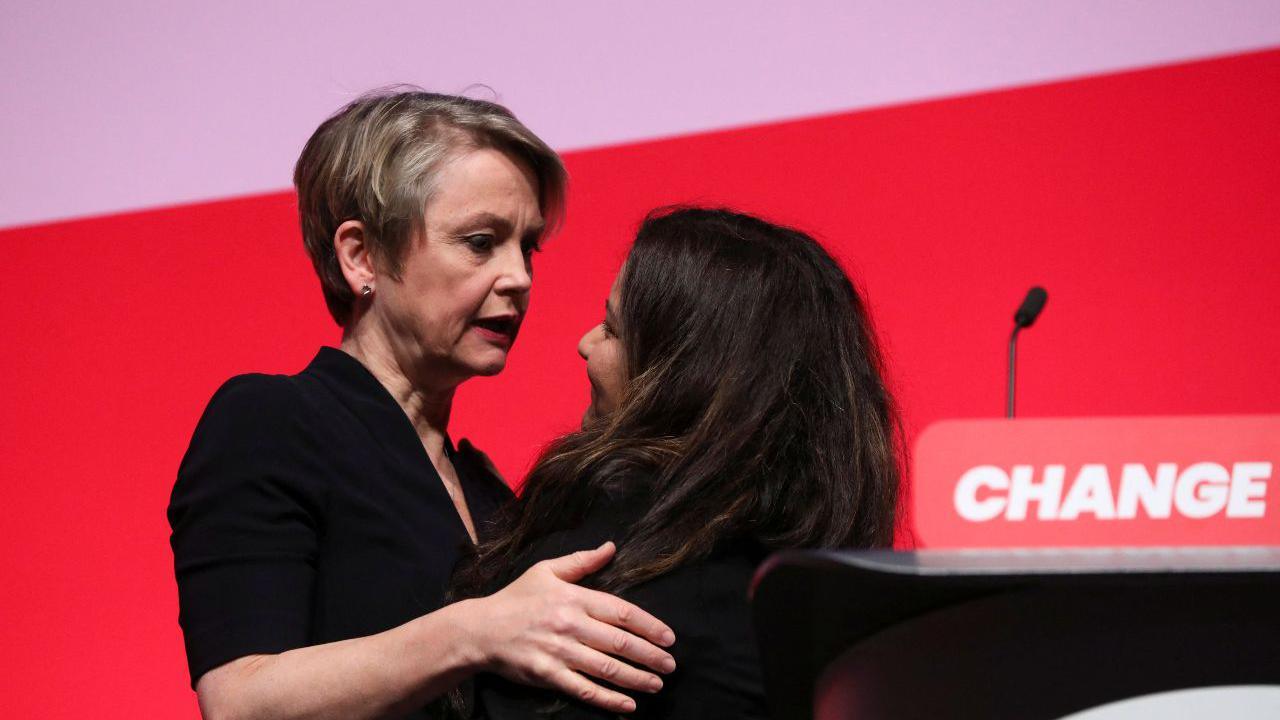 Home Secretary Yvette Cooper embraces Pooja Kanda on stage at Labour conference